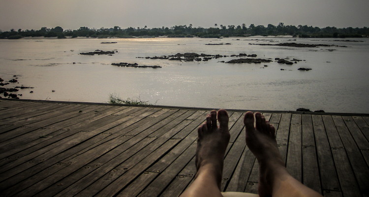 Tongabezi Lodge Victoria Falls sampan floating deck silver service dinner for two Zambezi River anchored