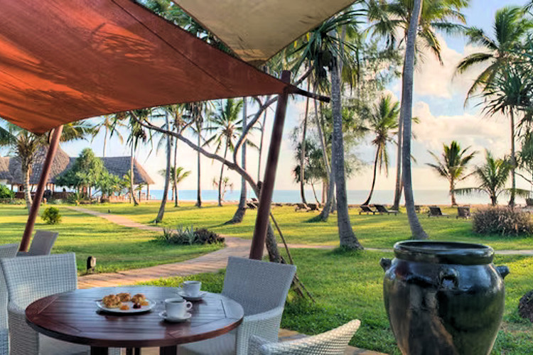10-best-lodges-in-zanzibar-2.jpg A scenic view of Bluebay Beach Resort, featuring its stunning beachfront and pool area