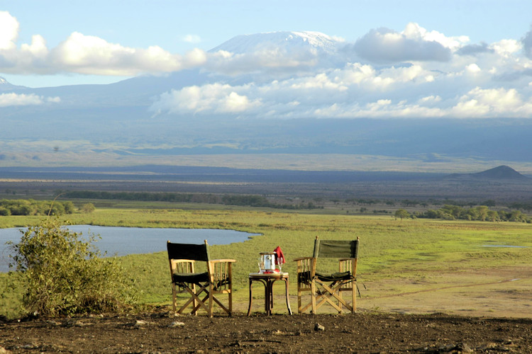 10-reasons-to-visit-amboseli-national-park-4.jpg Amboseli Lake surrounded by wildlife, a key attraction for visitors.