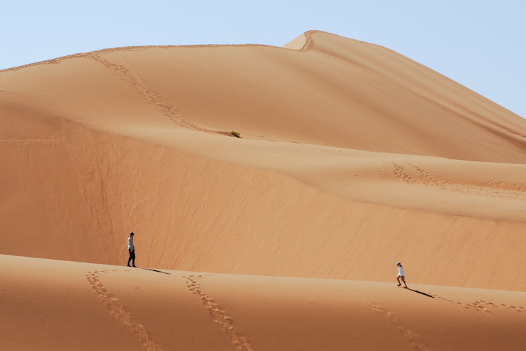 The towering red sand dunes of the Namib Desert, a natural wonder.