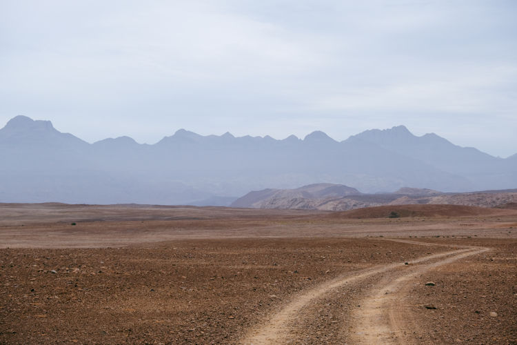 Damaraland Namibia desert landscape rocky outcrops dramatic sky 2026 safari destination