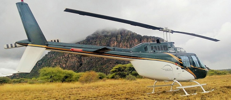 Helicopter day tour Tsodilo Hills UNESCO 24000 year rock art Maun Botswana half day full day
