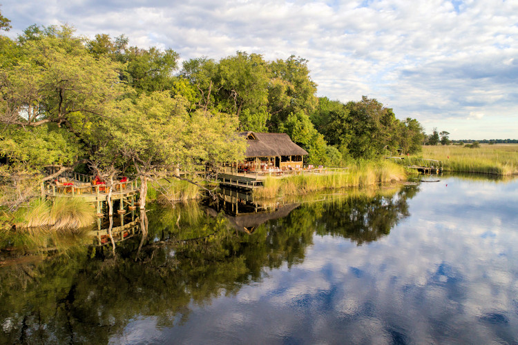 Xakanaxa Camp Moremi raised canvas tents Xakanaxa Lagoon leopard sightings wild dogs Botswana