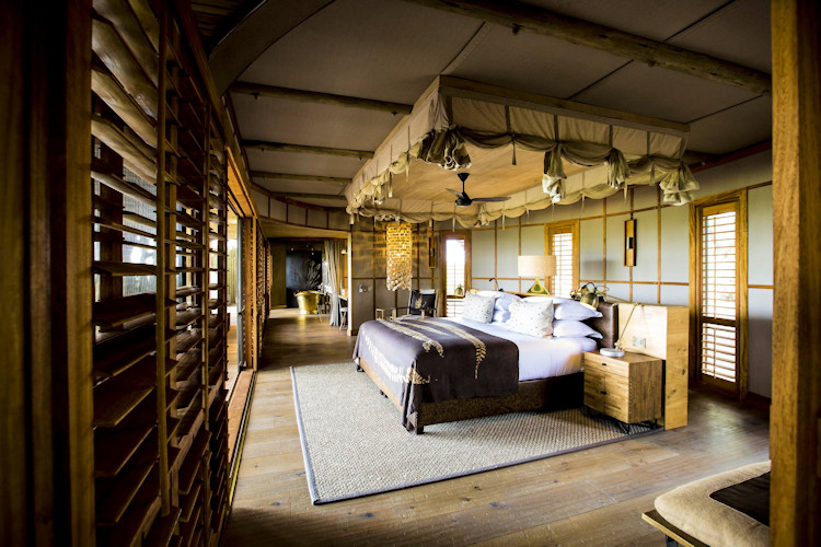 Mombo Camp luxury tented suite private deck plunge pool Okavango Delta floodplain wildlife views Botswana