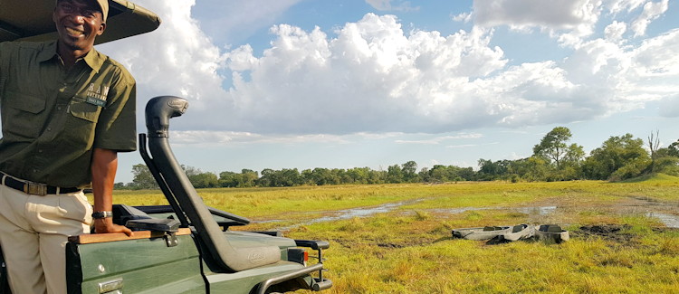 Mokoro safari Botswana Ryan personal experience hippo surfacing reeds channel waterway calm tranquil Okavango