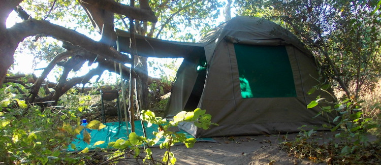 Camping Okavango Delta Botswana mobile camp erected tented camp meals pit oven wilderness stars animals