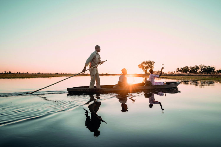 Boating safari mokoro excursion Okavango Delta waterways birds wildlife honeymoon Botswana