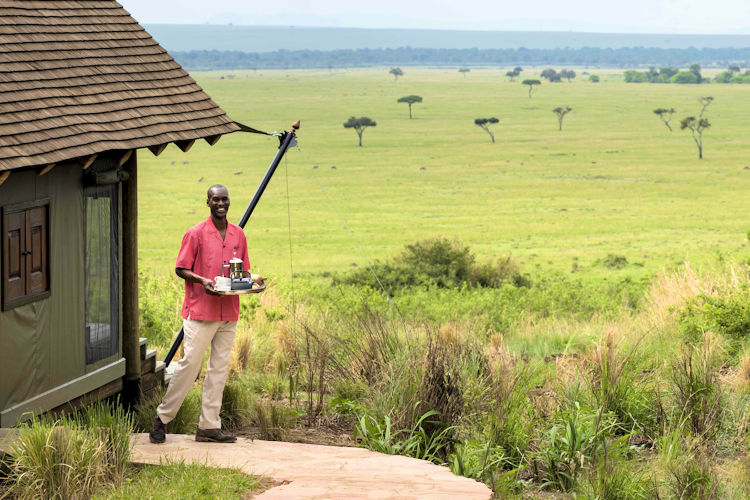 Planning a safari in Maasai Mara with maps and travel essentials.