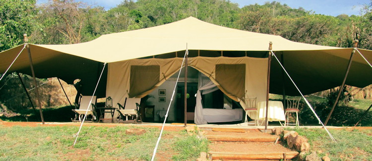 Cottars 1920s Camp Kenya mess tent Africana books antique furnishings framed family photographs 1920s atmosphere