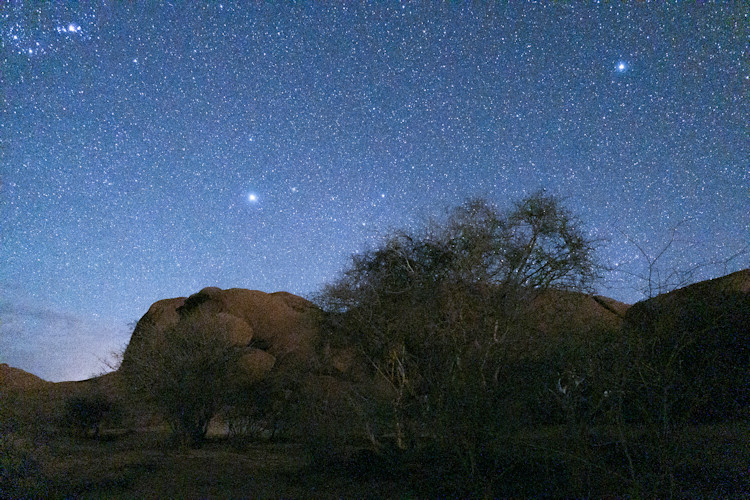 namibia-travel-bucket-list-5.jpg A captivating view of the night sky in Namibia, perfect for stargazing enthusiasts.