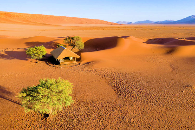 Kwessi Dunes NamibRand Nature Reserve luxury tented suites indoor outdoor showers gravel plains wildlife