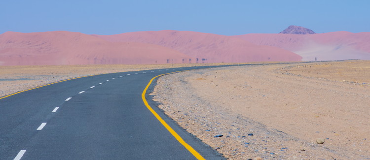 Road to Sossusvlei Namibia tarred bliss orange red dunes morning light Sesriem entrance photography