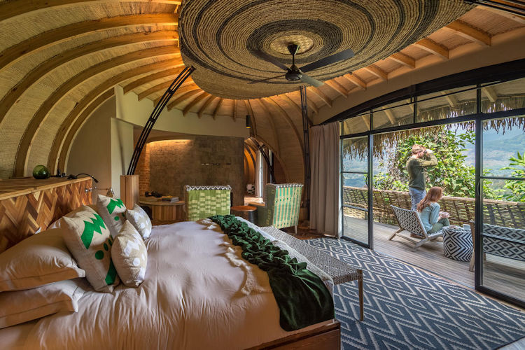 Luxury lodge Rwanda honeymoon Wilderness Bisate Sabyinyo Virunga Lodge private deck volcanic views