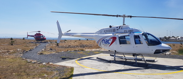 Helicopter flight Cape Town NAC V&A Waterfront departure blue January skies Table Mountain aerial view