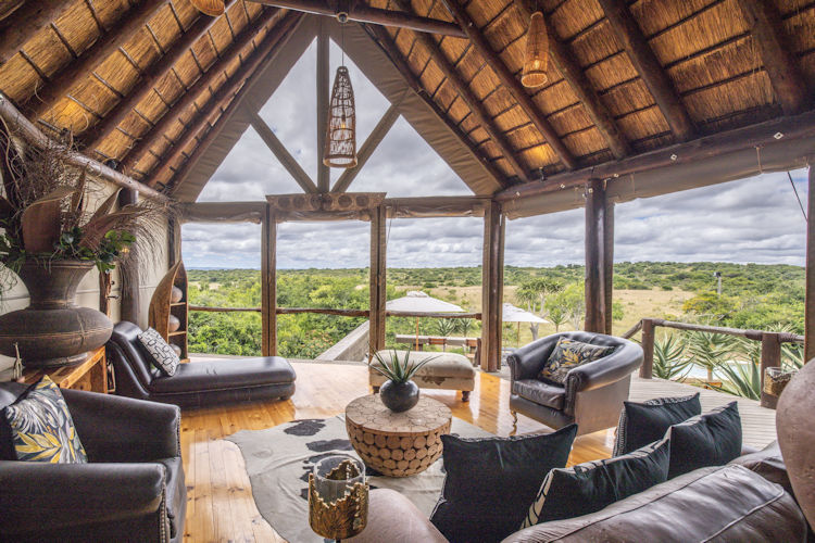 Luxury tented safari suite with canvas walls and wooden deck overlooking Eastern Cape bushveld