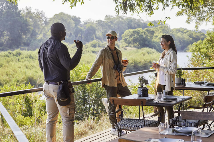 Luxury safari lodge suite private plunge pool African savanna sunset romantic Kruger honeymoon