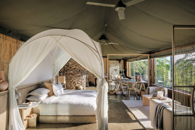 spectacular-serengeti-lodges.jpg A stunning view of one of the best Serengeti lodges - featuring luxurious tents, a swimming pool, and a breathtaking natural landscape