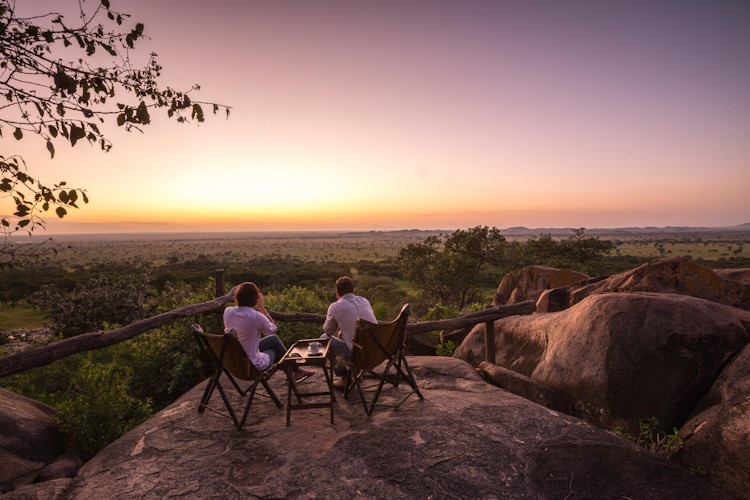 Couple Serengeti National Park Tanzania honeymoon wildlife safari romantic adventure