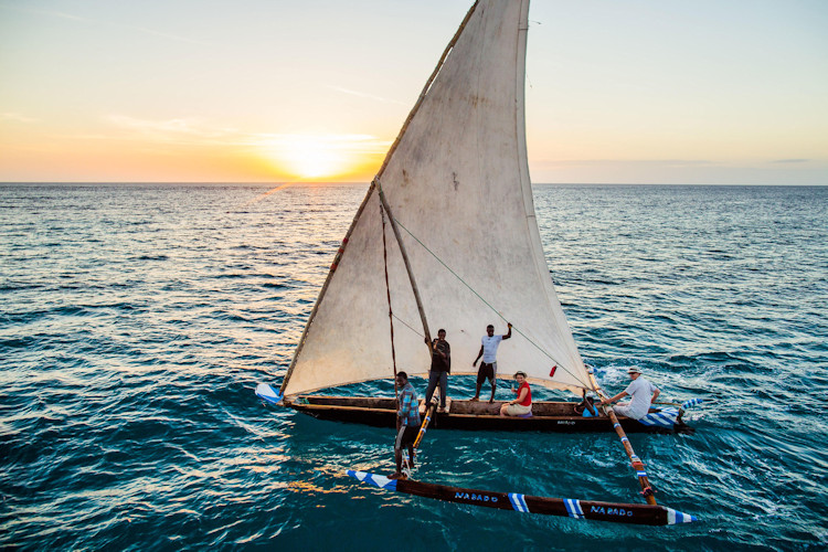 Romantic sunset cruise Tanzania Zanzibar dhow Indian Ocean couple honeymoon