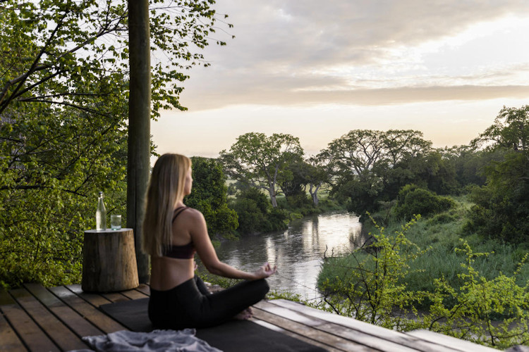 Couple romantic Tanzania honeymoon safari dry season wildlife viewing Serengeti Zanzibar