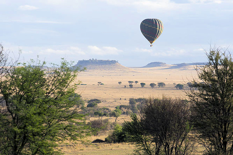 Serengeti game drive hot air balloon Maasai village walk spa wellness Tanzania safari activities