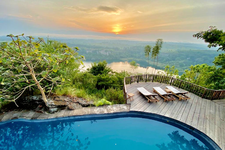Kyaninga Lodge Kibale timber thatch crater lake Kyaninga chimpanzee trekking Uganda