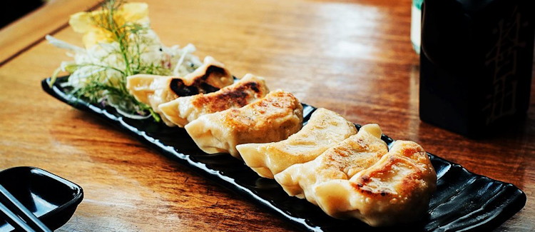 Yujo Izakaya Kampala sushi restaurant wooden bar lanterns imported salmon tuna Nakasero Hill Uganda