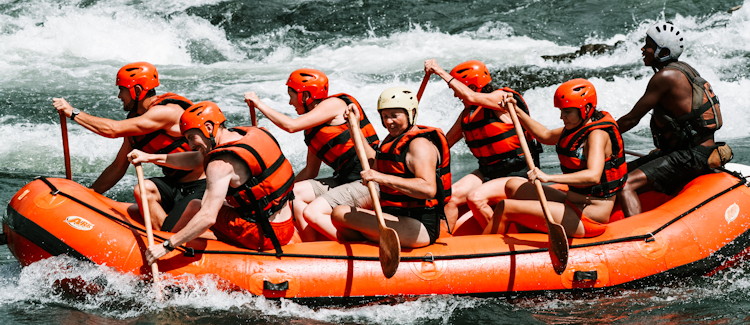 White water rafting Uganda Nile River grade 5 rapid raft flip support crew safety Jinja Uganda