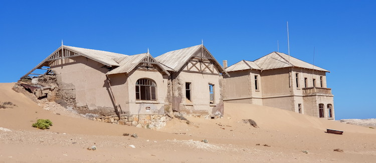 Kolmanskop Namibia ghost town diamond mining German colonial sand dunes Lüderitz eerie abandoned buildings