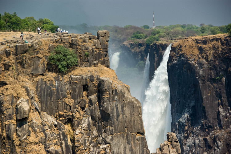 Victoria Falls Mosi-oa-Tunya largest waterfall world nearly 2km wide 500m mist Zambezi River Zimbabwe