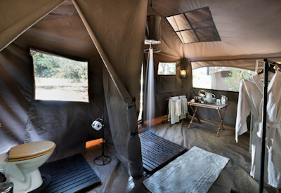 En-suite bathroom with bucket shower and toilet