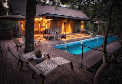 Swimming pool and sun loungers