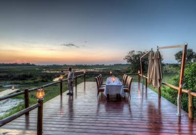 Kanana dining deck at sunset with figs ebony and knobthorn trees