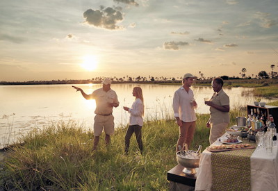 Okavango Sanctuary camp sunset drinks