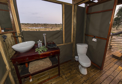En-suite toilet with bucket shower