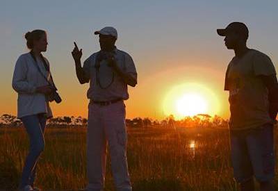 Botswana sunset Okavango Delta Xaxaba Island campfire mobile safari Delta Moremi