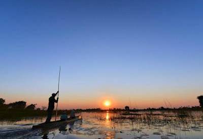 Okavango Delta boat cruise Thamalakane River Maun to Xaxaba Island Botswana mobile safari