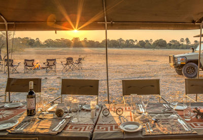 Letaka Safaris open-air bush dinner sunset campfire game viewer Botswana mobile safari
