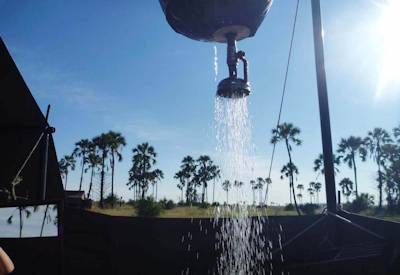 Bucket shower luxury mobile camp Central Kalahari Game Reserve Botswana safari