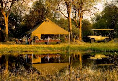 Luxury tented camp Boro River banks Moremi Game Reserve boat-access only Botswana