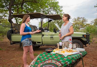Sundowner drinks bush table two guests Discover Botswana luxury mobile tented safari