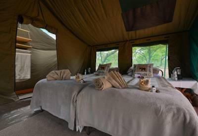 En-suite Meru-style tented bedroom bucket shower Discover Botswana Camping Safari