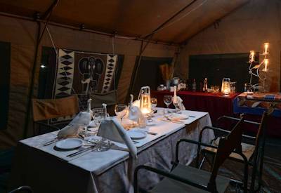 Indoor dining tent open fire 3-course dinner Discover Botswana Wildlife Safari Moremi