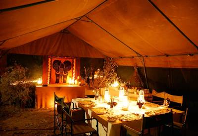 Open fire dining safari tent Moremi Game Reserve Discover Moremi Safari Botswana