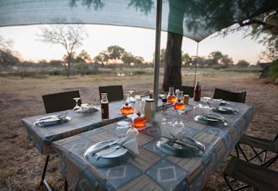 Open air dining wilds Livingstone Safari Khwai Savuti Chobe mobile camping Botswana