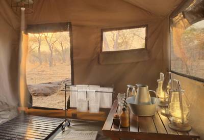 Private en-suite al fresco bucket shower Savute Under Canvas Chobe National Park Botswana