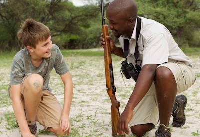 Children tracking wildlife Shinde Footsteps Camp Okavango Delta Young Explorers Botswana