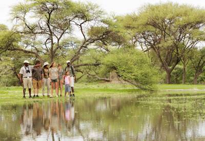 Family walking safari Shinde Footsteps Camp Okavango Delta Botswana children