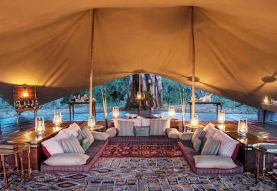 Tented lounge area mobile camp Okavango Delta channels islands Botswana