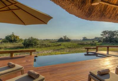 Relaxing African sun Camp Okavango elevated pool family Okavango Delta Botswana